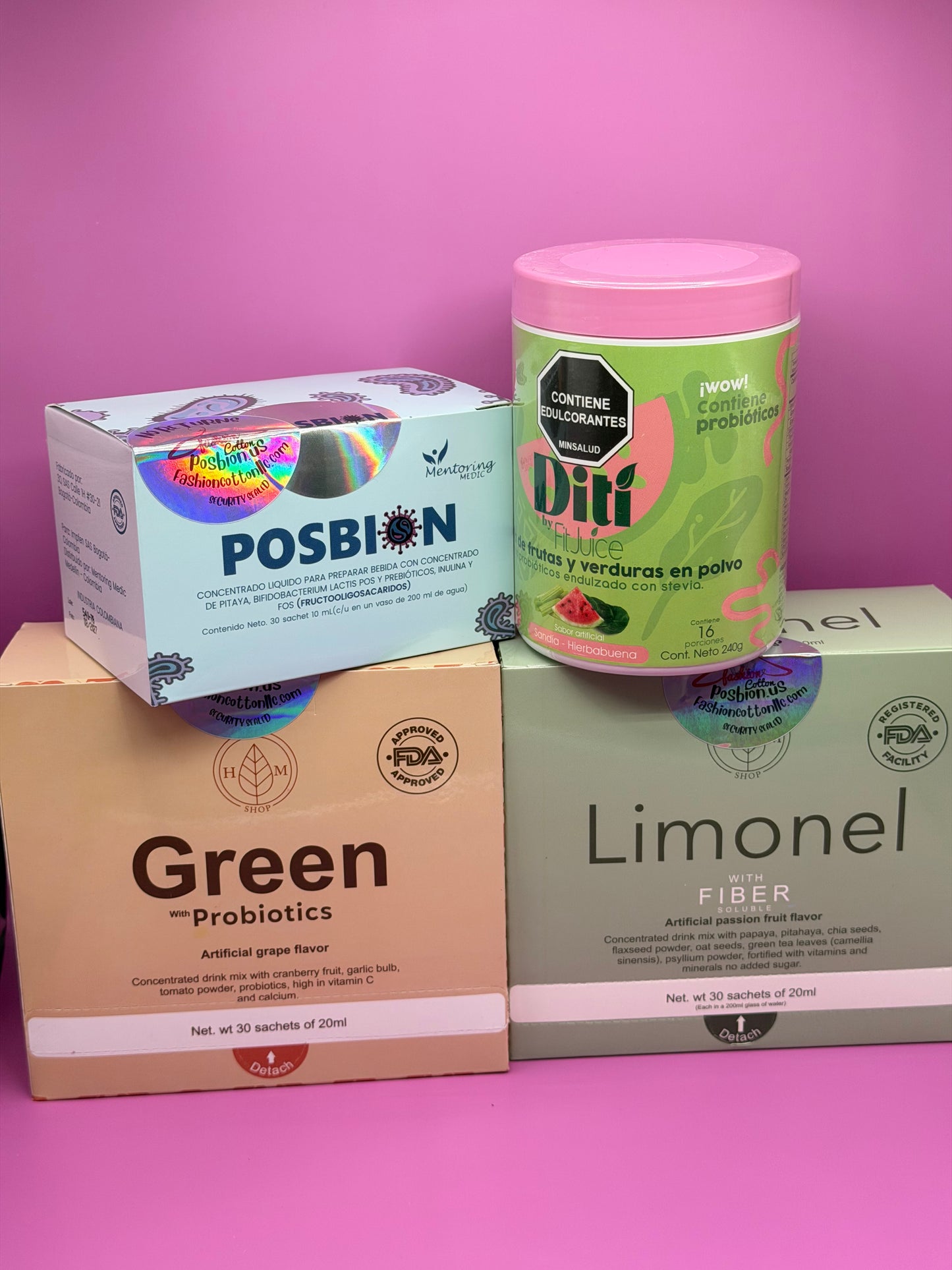 Collection of health and wellness products including a container and boxes on a pink background