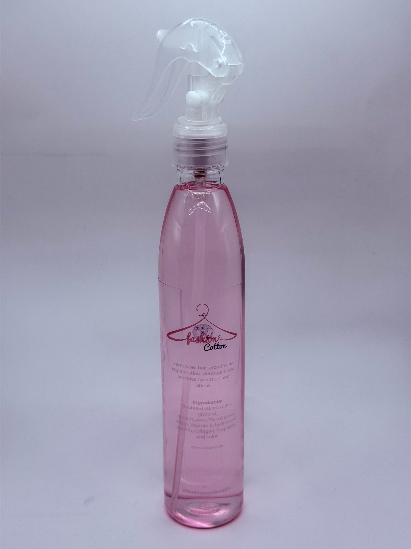 Pink bottle with a nozzle on a white background
