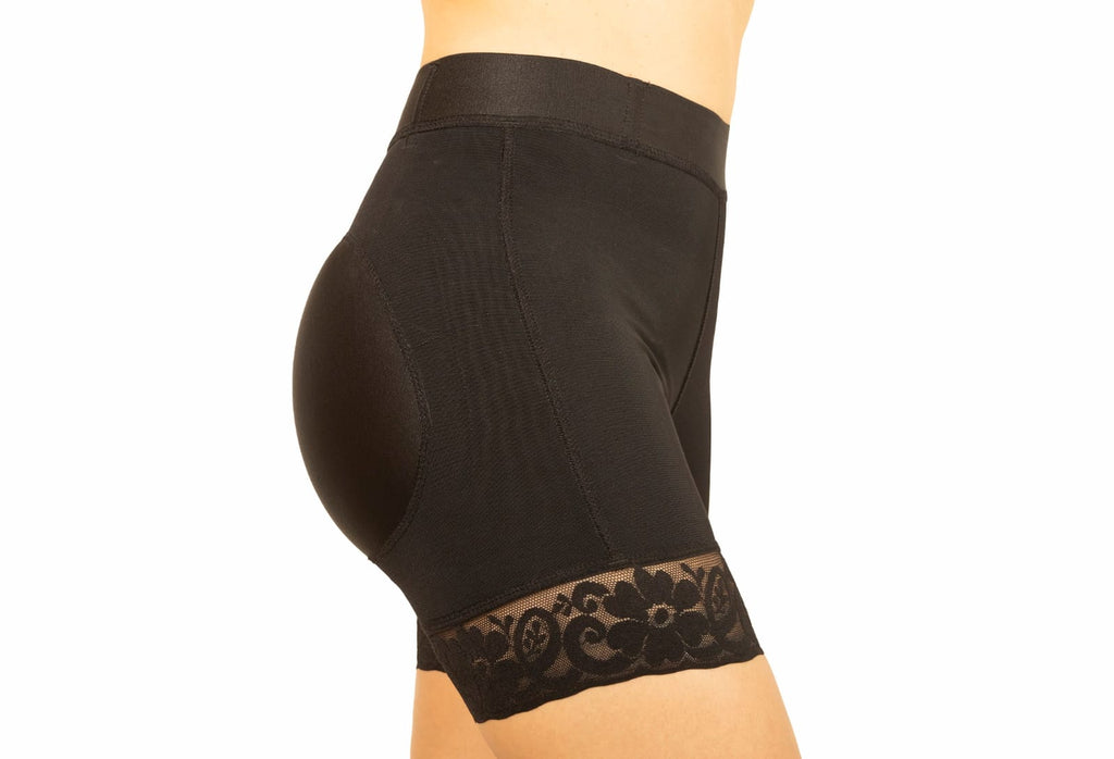 Black shapewear shorts with lace trim on a white background